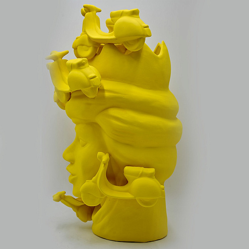 Matowa żółta rzeźba Głowa Maura