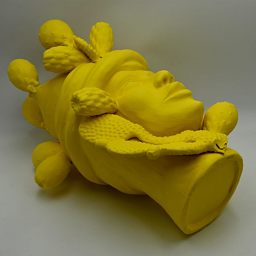 Ręcznie wykonana żółta rzeźba Głowa Maura